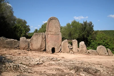 The upright central stele and curved stone facade of Coddu Vecchiu