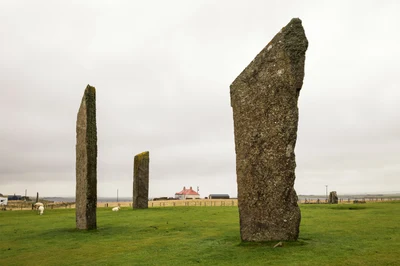 The tall Standing Stones of Stenness against an open Orkney sky